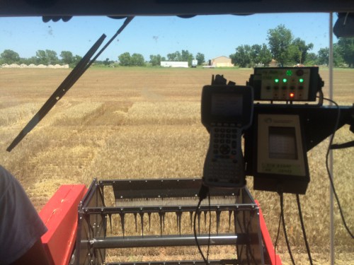 The view from the driver seat of the Massey 8XP, with the Harvest Master on the right.